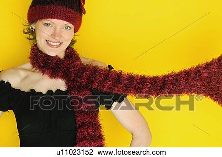 Stock Image - Woman modeling winter hat and scarf. Fotosearch