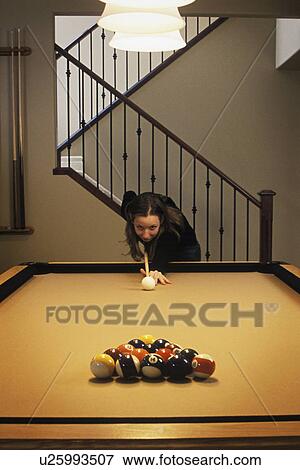 Stock Photo - Woman playing pool game. Fotosearch
