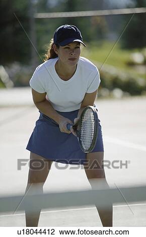 Woman plays tennis View Large Photo Image Stock Image - Woman plays tennis. Fotosearch
