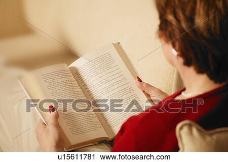Stock Image - Woman reads a book. Fotosearch