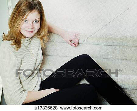 Stock Photo - Woman sitting down. Fotosearch
