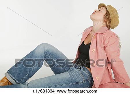 Woman sitting with head back View Large Photo Image Picture - Woman sitting with head back. Fotosearch