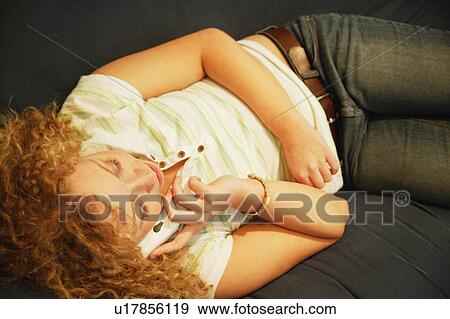 Stock Photo - Woman talking on the phone. Fotosearch