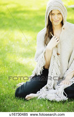 Woman wearing a knit cape View Large Photo Image Stock Photography - Woman wearing a knit cape. Fotosearch