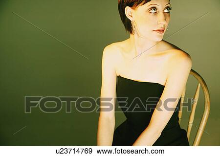 Woman wearing strapless black dress View Large Photo Image Stock Photo - Woman wearing strapless black dress. Fotosearch