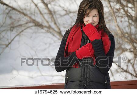 Woman with a red scarf and mittens View Large Photo Image Stock Photography - Woman with a red scarf and mittens. Fotosearch