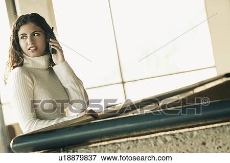 Woman with cell phone View Large Photo Image Stock Photo - Woman with cell phone. Fotosearch