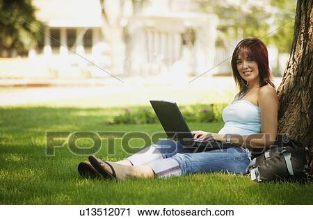Stock Image - Woman with laptop computer. Fotosearch