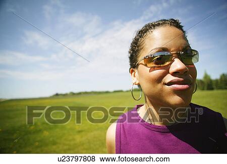 Woman with sunglasses View Large Photo Image Stock Photo - Woman with sunglasses. Fotosearch