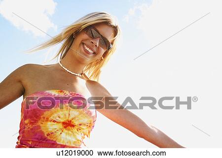 Woman with trendy shirt View Large Photo Image Stock Image - Woman with trendy shirt. Fotosearch