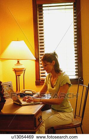 Stock Photo - Working on computer. Fotosearch