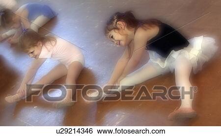 Young girls stretching in Ballet class View Large Photo Image Stock Photograph - Young girls stretching in Ballet class. Fotosearch