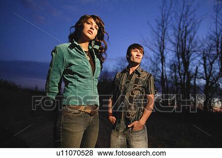 Young trendy couple outside View Large Photo Image Stock Photo - Young trendy couple outside. Fotosearch