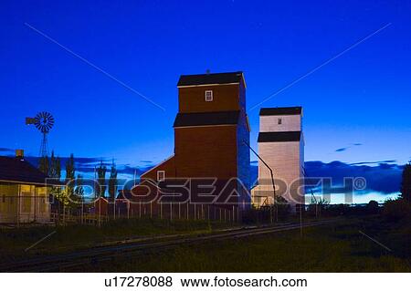 Stock Photo - Grain elevators on a farm. Fotosearch