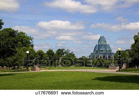Stock Image - Green open space and glass construction. Fotosearch