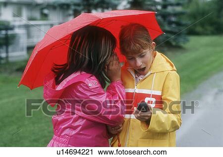Children in the rain View Large Photo Image Stock Image - Children in the rain. Fotosearch