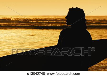 Stock Photo - Silhouette of a surfer. Fotosearch