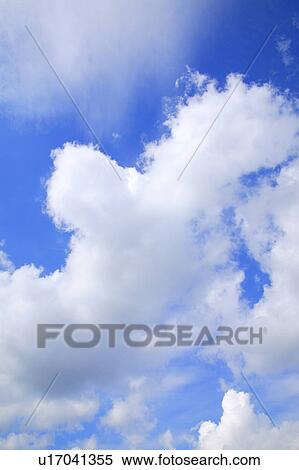 Clouds in a blue sky View Large Photo Image Stock Photography - Clouds in a blue sky. Fotosearch