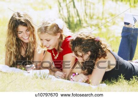 Stock Image - Friends studying outside. Fotosearch