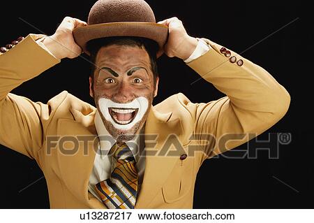Holding onto his hat View Large Photo Image Stock Photo - Holding onto his hat. Fotosearch