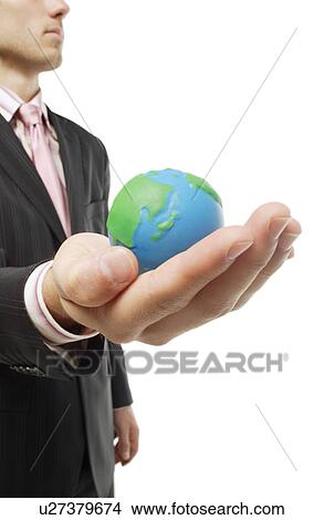 Picture - Holding the world in his hand. Fotosearch