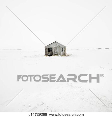 Stock Photo - Abandoned house in snow covered landscape.. Fotosearch