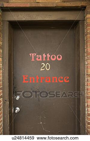 Stock Photo - Doorway entrance to tattoo parlor.. Fotosearch