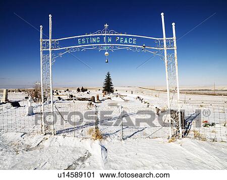 Stock Image - Entrance to graveyard reading esting in peace.. Fotosearch