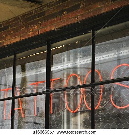 Neon sign in window for tattoos and body piercing. View Large Photo Image Stock Photo - Neon sign in window for tattoos and body piercing.. Fotosearch