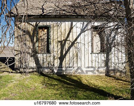 Old rundown building with tree and unique shadow in Utah, USA. View Large Photo Image Stock Image - Old rundown building with tree and unique shadow in Utah, USA.. Fotosearch