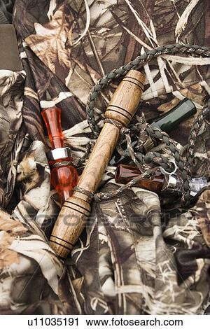 Still life shot of bird calls against camouflage clothing. View Large Photo Image Stock Image - Still life shot of bird calls against camouflage clothing.. Fotosearch
