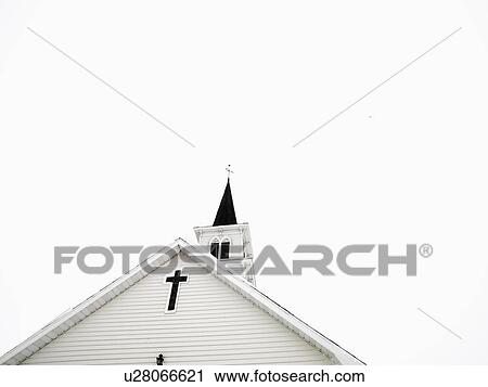 Top of white church with clear sky in background. View Large Photo Image Stock Image - Top of white church with clear sky in background.. Fotosearch