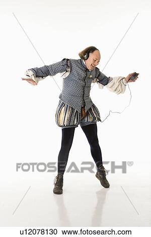 Stock Image - William Shakespeare in period clothing listening to mp3 player and dancing.. Fotosearch
