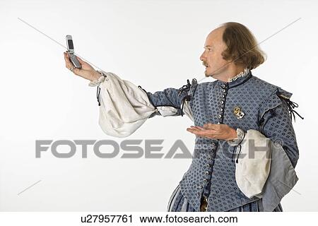 William Shakespeare in period clothing holding cell phone and gesturing. View Large Photo Image Stock Image - William Shakespeare in period clothing holding cell phone and gesturing.. Fotosearch