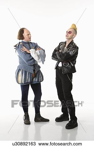 William Shakespeare in period clothing and gothic punk young man standing face to face with arms crossed. View Large Photo Image Stock Image - William Shakespeare in period clothing and gothic punk young man standing face to face with arms crossed.. Fotosearch