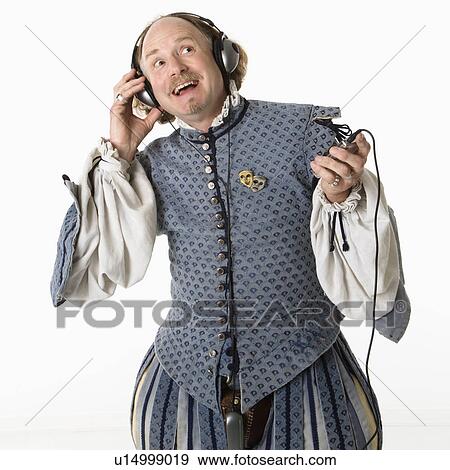 William Shakespeare in period clothing listening to mp3 player and smiling.. View Large Photo Image Stock Photo - William Shakespeare in period clothing listening to mp3 player and smiling... Fotosearch