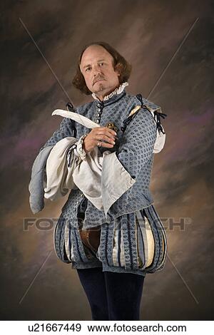 William Shakespeare in period clothing holding feather pen and looking at viewer. View Large Photo Image Stock Photo - William Shakespeare in period clothing holding feather pen and looking at viewer.. Fotosearch