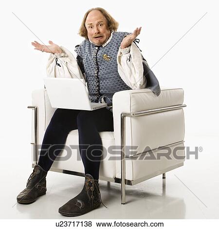 William Shakespeare in period clothing sitting on modern chair with laptop and shrugging with confusion at viewer. View Large Photo Image Stock Photo - William Shakespeare in period clothing sitting on modern chair with laptop and shrugging with confusion at viewer.. Fotosearch