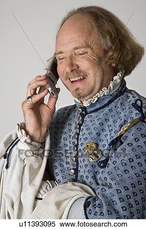 William Shakespeare in period clothing talking on cell phone and laughing. View Large Photo Image Stock Photography - William Shakespeare in period clothing talking on cell phone and laughing.. Fotosearch