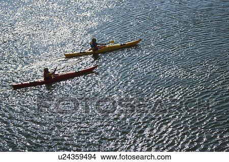 Aerial of two teenage boys kayaking on Bald Head Island, North Carolina. View Large Photo Image Picture - Aerial of two teenage boys kayaking on Bald Head Island, North Carolina.. Fotosearch