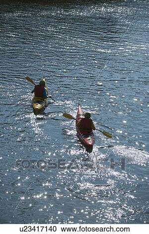 Aerial of two teenage boys kayaking on Bald Head Island, North Carolina. View Large Photo Image Stock Image - Aerial of two teenage boys kayaking on Bald Head Island, North Carolina.. Fotosearch