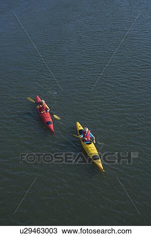 Aerial of two teenage boys kayaking on Bald Head Island in North Carolina View Large Photo Image Stock Image - Aerial of two teenage boys kayaking on Bald Head Island in North Carolina. Fotosearch