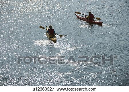 Aerial of two teenage boys kayaking on Bald Head Island, North Carolina. View Large Photo Image Stock Photo - Aerial of two teenage boys kayaking on Bald Head Island, North Carolina.. Fotosearch