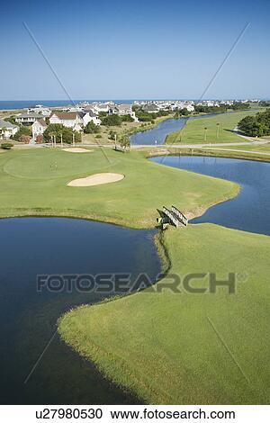Aerial view of golf course in coastal residential community at Bald Head Island, North Carolina. View Large Photo Image Stock Image - Aerial view of golf course in coastal residential community at Bald Head Island, North Carolina.. Fotosearch