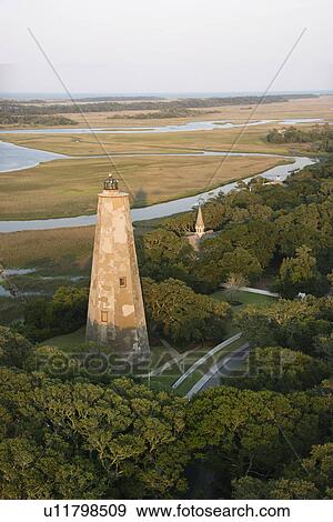 Aerial view of lighthouse on Bald Head Island, North Carolina. View Large Photo Image Stock Photo - Aerial view of lighthouse on Bald Head Island, North Carolina.. Fotosearch