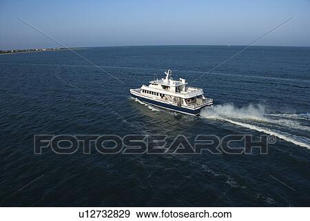 Aerial view of passenger ferry boat in open water near Bald Head Island, North Carolina. View Large Photo Image Stock Photo - Aerial view of passenger ferry boat in open water near Bald Head Island, North Carolina.. Fotosearch