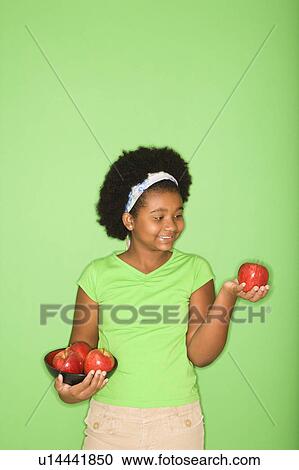 African American girl holding apples. View Large Photo Image Stock Image - African American girl holding apples.. Fotosearch
