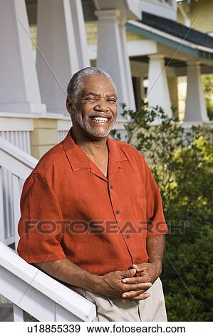Stock Photo - African American middle aged man smiling at viewer.. Fotosearch