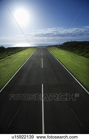 Stock Photo - Airplane runway with Pacific ocean in background.. Fotosearch