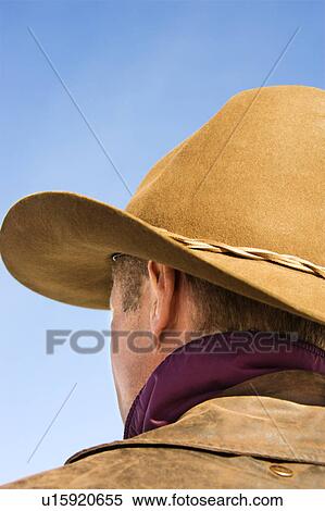 Back of a Middle-aged Caucasian male wearing a cowboy hat. View Large Photo Image Stock Photography - Back of a Middle-aged Caucasian male wearing a cowboy hat.. Fotosearch